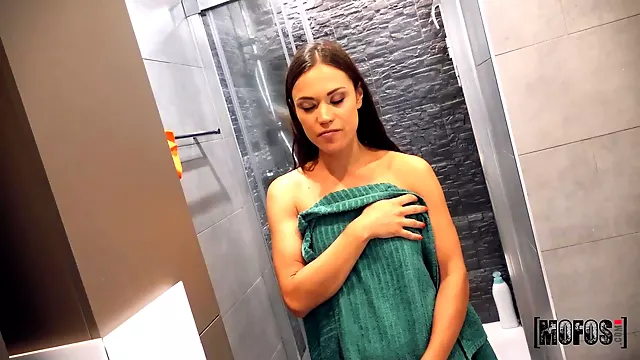 Dark-haired babe opens ass to get anal orgasm in bathroom