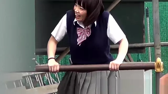 Naughty Japanese schoolgirls pissing in secret public place