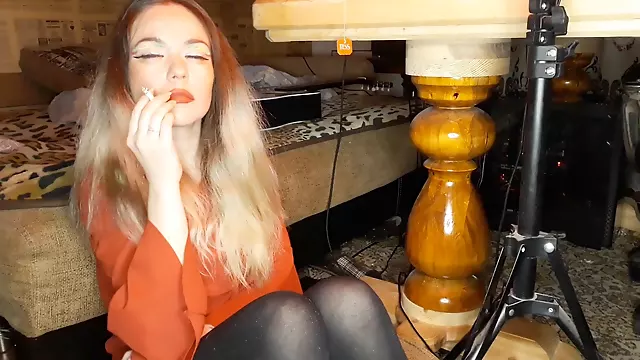 Seductive wife indulges in a sensual cigarette
