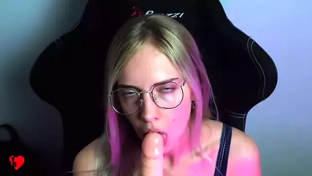 Beautiful bitch in glasses sucking dildo