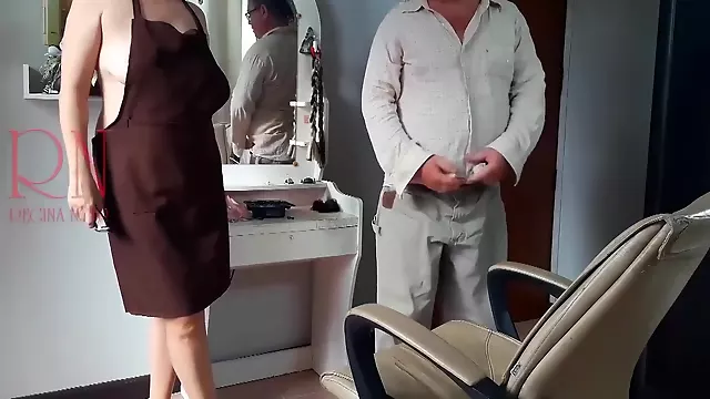 Nudist Barbershop. Nude Lady Hairdresser In An Apron Makes Client To Strip. The Client Is Surprised. S1