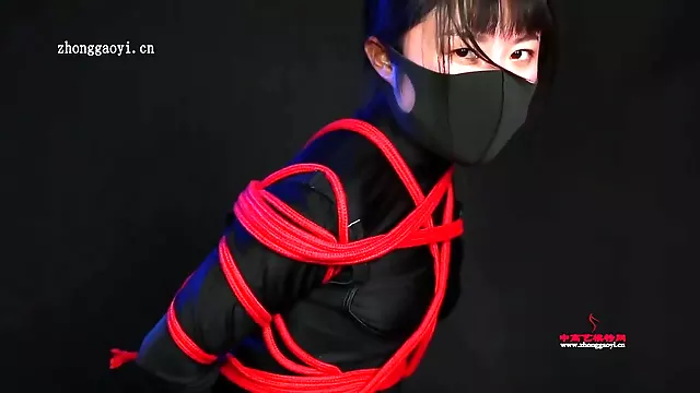 Ninja Girl Tied In Red Ropes